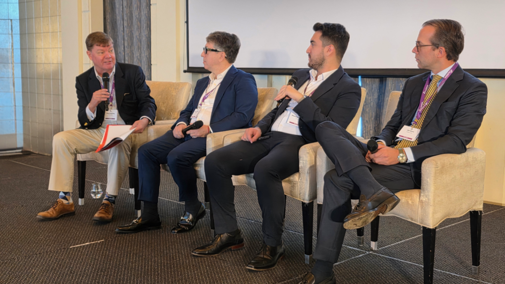 Bryan Henning chairing a panel discussion on AI in family offices